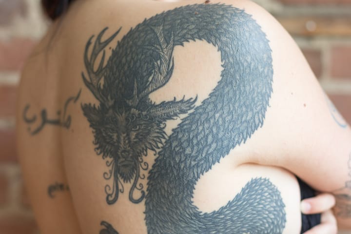 Weaving a dragon tattoo